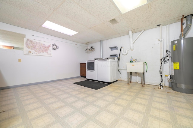 20 Snider Rd, New Carlisle, OH 45344 - finished below grade area featuring water heater, washer and clothes dryer, light floors, baseboards, and a paneled ceiling