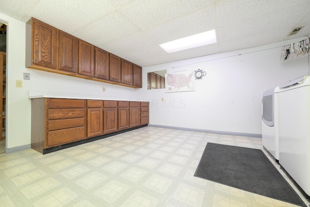 20 Snider Rd, New Carlisle, OH 45344 - laundry room with washer and dryer, cabinet space, light floors, and baseboards