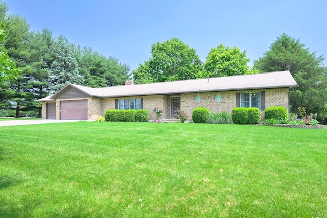 20 Snider Rd, New Carlisle, OH 45344 - single story home with an attached garage, brick siding, a front yard, and driveway