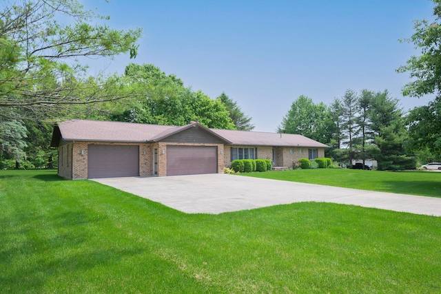 20 Snider Rd, New Carlisle, OH 45344 - ranch-style house with a front yard, driveway, an attached garage, and brick siding