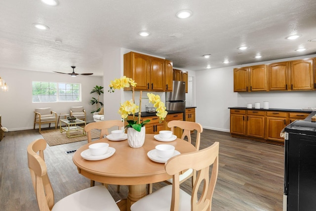3944 Ardath Rd, Columbus, OH 43228 - dining area with baseboards, recessed lighting, ceiling fan, a textured ceiling, and wood finished floors