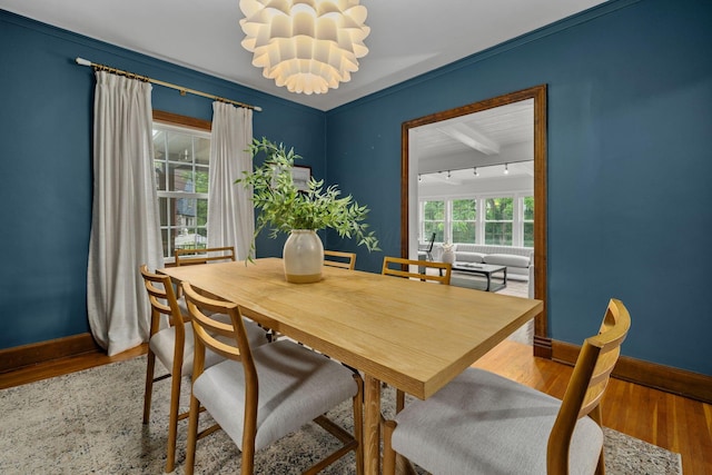 137 E Torrence Rd, Columbus, OH 43214 - dining space featuring baseboards, a chandelier, wood finished floors, and track lighting