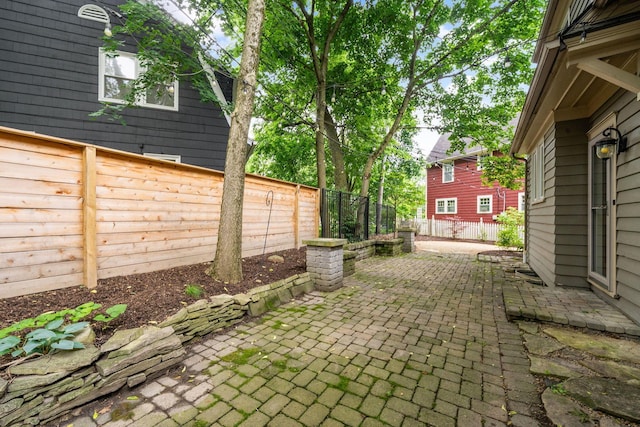 137 E Torrence Rd, Columbus, OH 43214 - fenced backyard featuring a patio