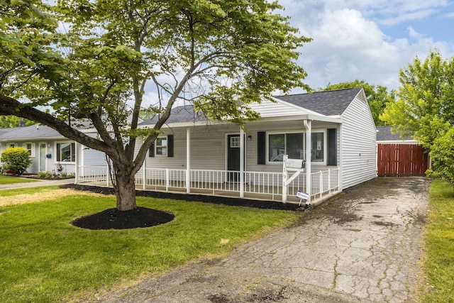 191 Saint Christopher Ln, Columbus, OH 43213 - view of front of house with a shingled roof, a porch, and driveway