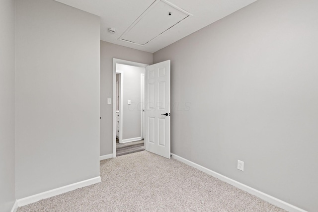 191 Saint Christopher Ln, Columbus, OH 43213 - unfurnished room featuring attic access, baseboards, carpet floors, and a smoke detector