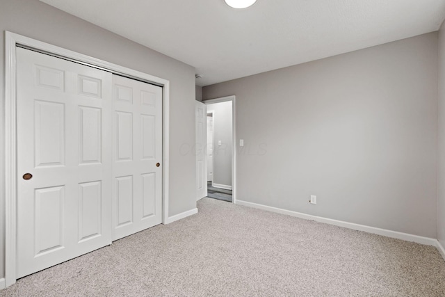 191 Saint Christopher Ln, Columbus, OH 43213 - unfurnished bedroom with carpet floors, baseboards, and a closet
