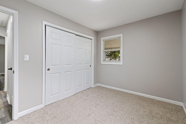191 Saint Christopher Ln, Columbus, OH 43213 - unfurnished bedroom featuring carpet flooring, baseboards, and a closet