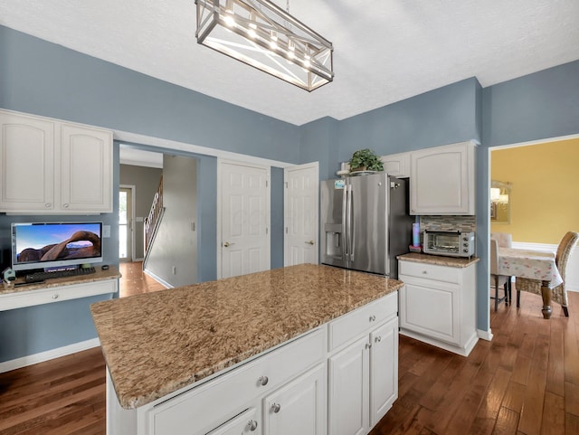 6048 Trent Ct, Lewis Center, OH 43035 - kitchen featuring stainless steel fridge, dark wood finished floors, white cabinetry, a chandelier, and baseboards