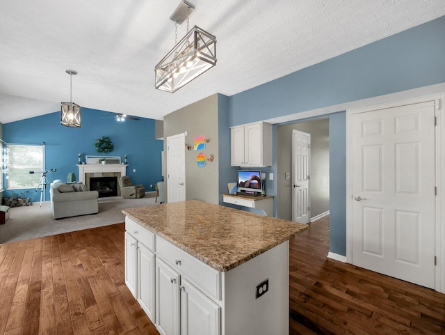 6048 Trent Ct, Lewis Center, OH 43035 - kitchen with dark wood-type flooring, a center island, white cabinets, and lofted ceiling
