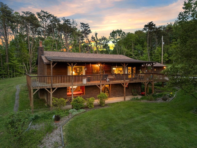 26975 Chapel Ridge Rd, South Bloomingville, OH 43152 - back of property at dusk featuring a yard and a deck