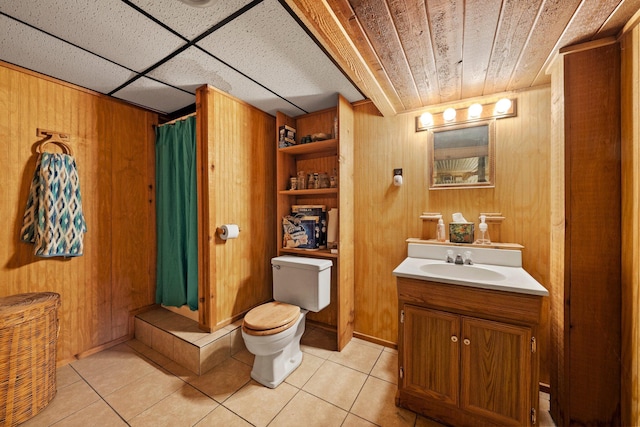 26975 Chapel Ridge Rd, South Bloomingville, OH 43152 - full bath with vanity, toilet, tile patterned flooring, wooden walls, and a shower with shower curtain