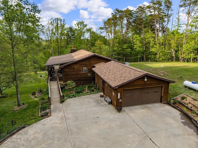26975 Chapel Ridge Rd, South Bloomingville, OH 43152 - garage with a forest view and driveway