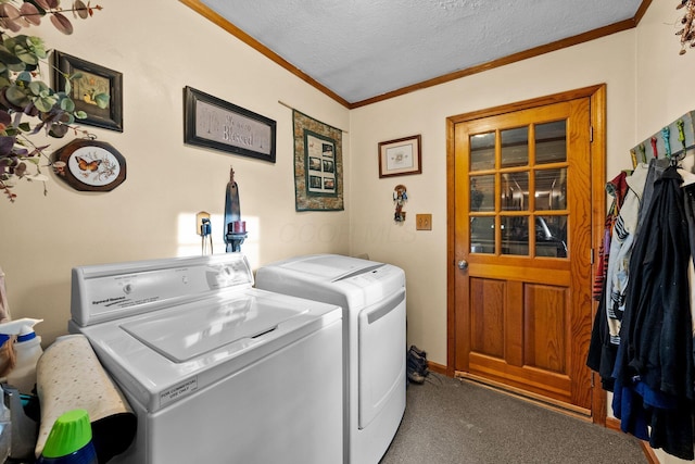 26975 Chapel Ridge Rd, South Bloomingville, OH 43152 - laundry area featuring washing machine and dryer, carpet floors, ornamental molding, and a textured ceiling