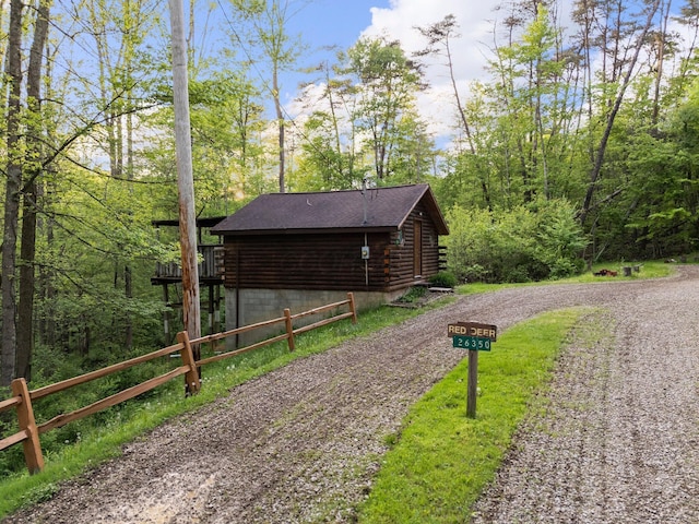 26975 Chapel Ridge Rd, South Bloomingville, OH 43152 - view of property exterior with log exterior and driveway