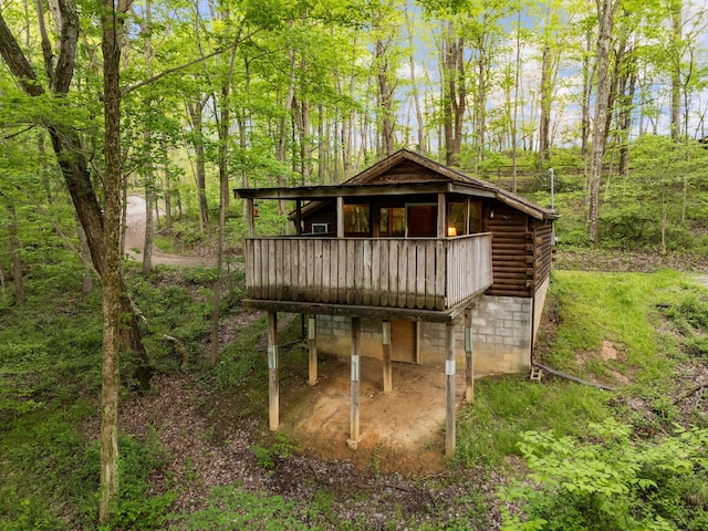 26975 Chapel Ridge Rd, South Bloomingville, OH 43152 - back of house featuring log exterior, a deck, and a forest view