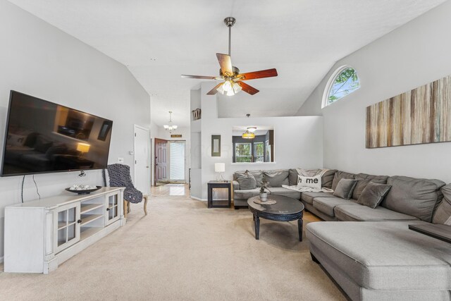 6389 Riverstone Dr, Columbus, OH 43228 - living room featuring light carpet, plenty of natural light, ceiling fan, and high vaulted ceiling