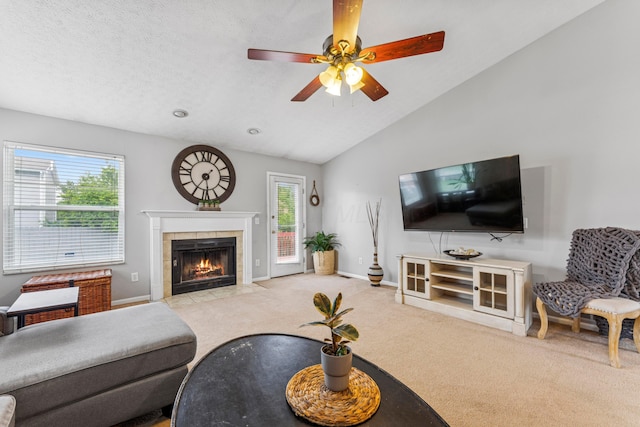 6389 Riverstone Dr, Columbus, OH 43228 - carpeted living room with a fireplace, lofted ceiling, baseboards, and ceiling fan
