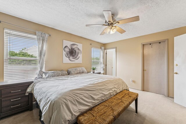 6389 Riverstone Dr, Columbus, OH 43228 - bedroom featuring carpet flooring, a textured ceiling, and ceiling fan