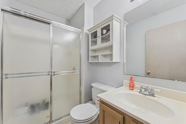 6389 Riverstone Dr, Columbus, OH 43228 - bathroom featuring toilet, a textured ceiling, an enclosed shower, and vanity