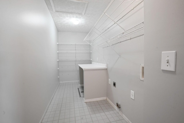 4655 Parrau Dr Unit 66A, Columbus, OH 43228 - laundry area with hookup for an electric dryer, baseboards, attic access, and a textured ceiling