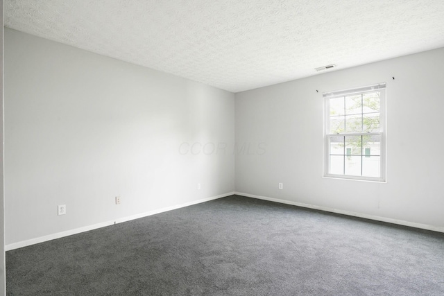 4655 Parrau Dr Unit 66A, Columbus, OH 43228 - unfurnished room with dark colored carpet, a textured ceiling, and baseboards