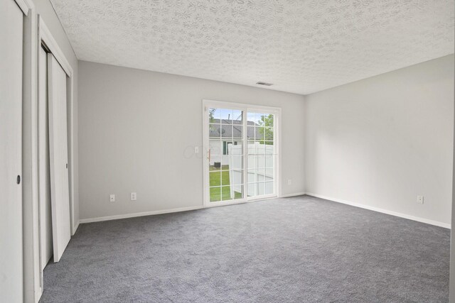 4655 Parrau Dr Unit 66A, Columbus, OH 43228 - unfurnished bedroom with carpet floors, baseboards, and a textured ceiling