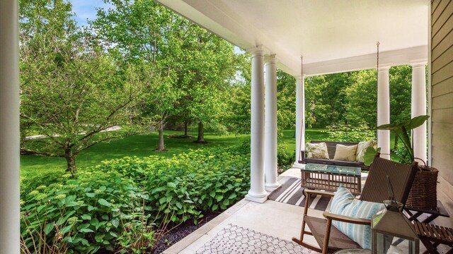 122 Boulder Ct, Granville, OH 43023 - covered porch featuring view of scattered trees and a lawn