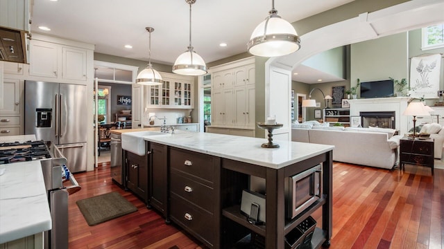 122 Boulder Ct, Granville, OH 43023 - kitchen featuring a sink, stainless steel appliances, dark brown cabinets, dark wood-style flooring, and recessed lighting