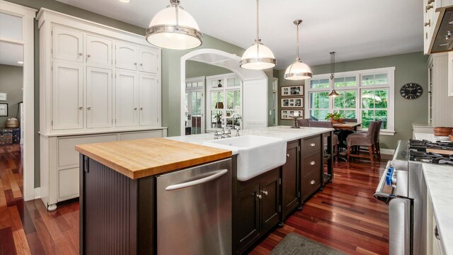 122 Boulder Ct, Granville, OH 43023 - kitchen featuring dishwasher, range with gas cooktop, a sink, wood counters, and dark wood-style floors