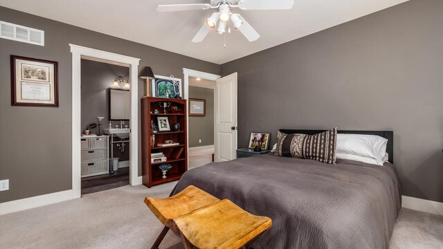 122 Boulder Ct, Granville, OH 43023 - carpeted bedroom with ensuite bathroom, baseboards, and a ceiling fan