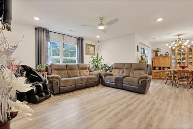 351 Trinity Way W, Newark, OH 43055 - living area with light wood finished floors, ceiling fan, a chandelier, and recessed lighting