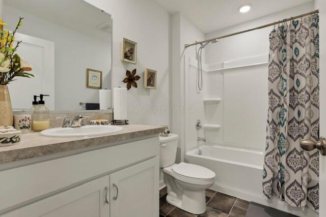 351 Trinity Way W, Newark, OH 43055 - full bathroom featuring toilet, vanity, shower / tub combo, and tile patterned flooring