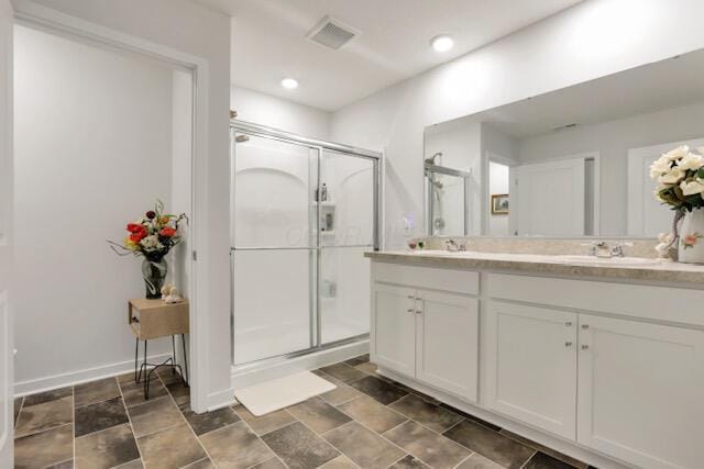 351 Trinity Way W, Newark, OH 43055 - bathroom featuring a shower stall, double vanity, recessed lighting, and baseboards