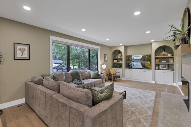 29 Pocono Rd, Columbus, OH 43235 - living area with light wood finished floors, recessed lighting, baseboards, and built in features