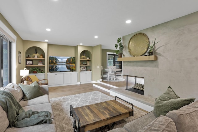 29 Pocono Rd, Columbus, OH 43235 - living area with wood finished floors, built in features, and recessed lighting