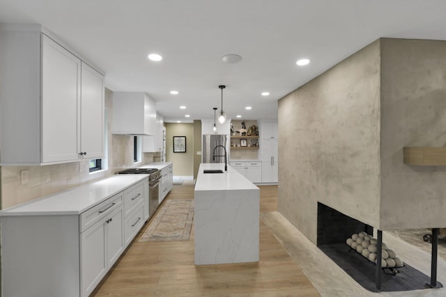 29 Pocono Rd, Columbus, OH 43235 - kitchen with a sink, high end stainless steel range, light wood-style flooring, open shelves, and recessed lighting