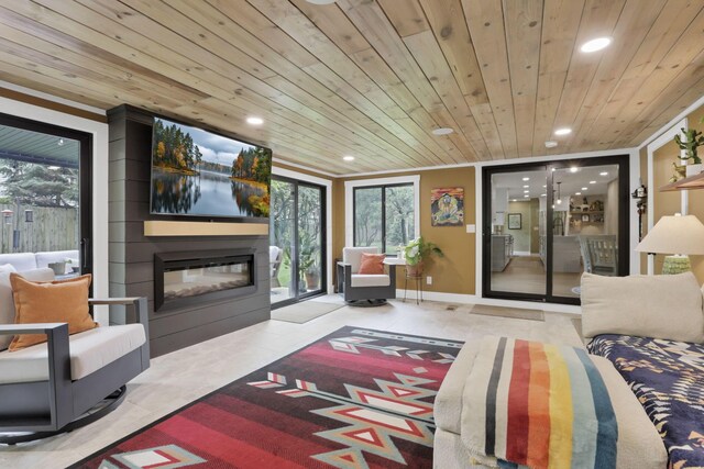 29 Pocono Rd, Columbus, OH 43235 - tiled living room with wood ceiling, recessed lighting, a fireplace, and plenty of natural light