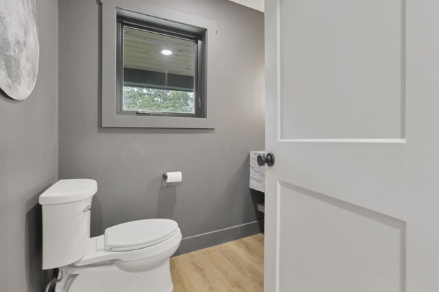 29 Pocono Rd, Columbus, OH 43235 - half bath with toilet, wood finished floors, and baseboards