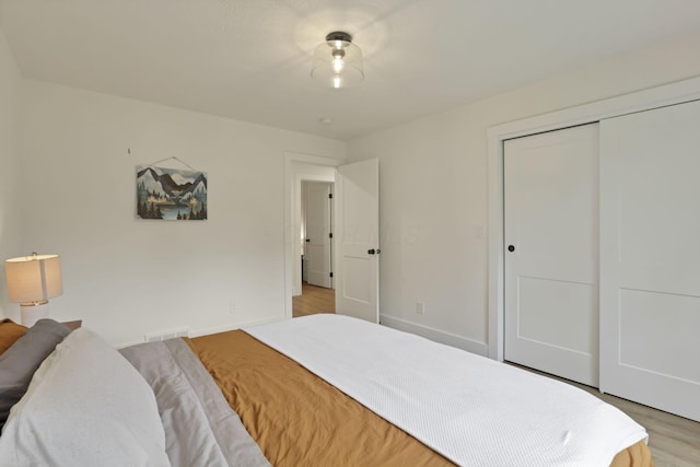 29 Pocono Rd, Columbus, OH 43235 - bedroom with a closet, light wood-style flooring, and baseboards