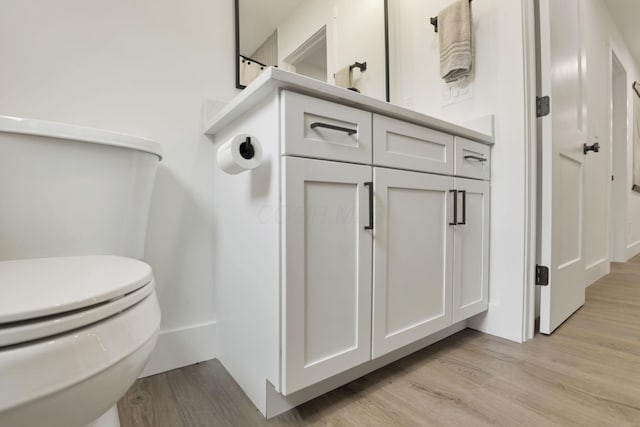 29 Pocono Rd, Columbus, OH 43235 - bathroom with toilet, wood finished floors, and vanity