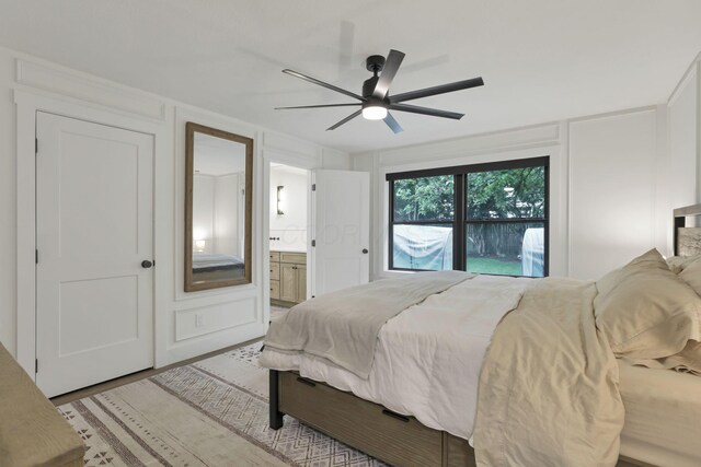 29 Pocono Rd, Columbus, OH 43235 - bedroom with connected bathroom, light wood-type flooring, and ceiling fan