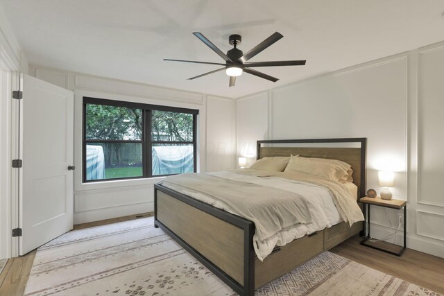 29 Pocono Rd, Columbus, OH 43235 - bedroom with a decorative wall, light wood-style floors, and ceiling fan