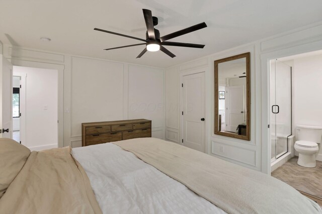 29 Pocono Rd, Columbus, OH 43235 - bedroom featuring a decorative wall, ensuite bathroom, and ceiling fan