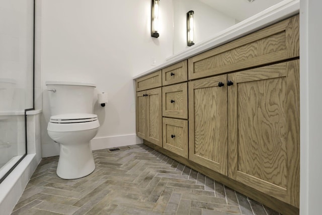 29 Pocono Rd, Columbus, OH 43235 - bathroom with baseboards, toilet, and a shower