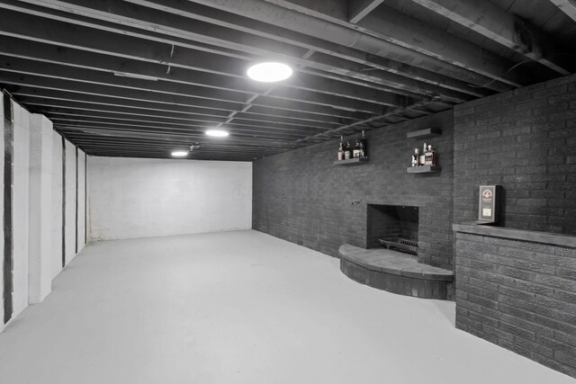 29 Pocono Rd, Columbus, OH 43235 - finished basement featuring a fireplace and brick wall