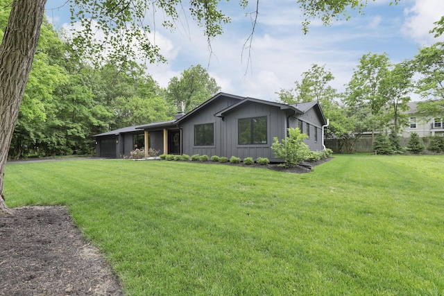 29 Pocono Rd, Columbus, OH 43235 - view of front of house with an attached garage and board and batten siding