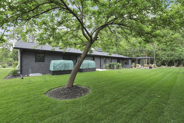 29 Pocono Rd, Columbus, OH 43235 - rear view of house featuring brick siding and a yard