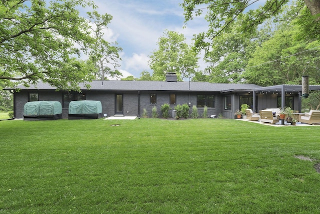 29 Pocono Rd, Columbus, OH 43235 - rear view of property featuring a patio area, a lawn, and outdoor lounge area