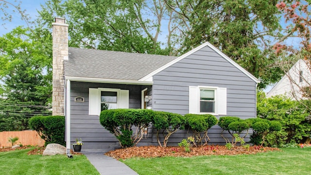 410 Wetmore Rd, Columbus, OH 43214 - bungalow-style home featuring a chimney, roof with shingles, and stairway