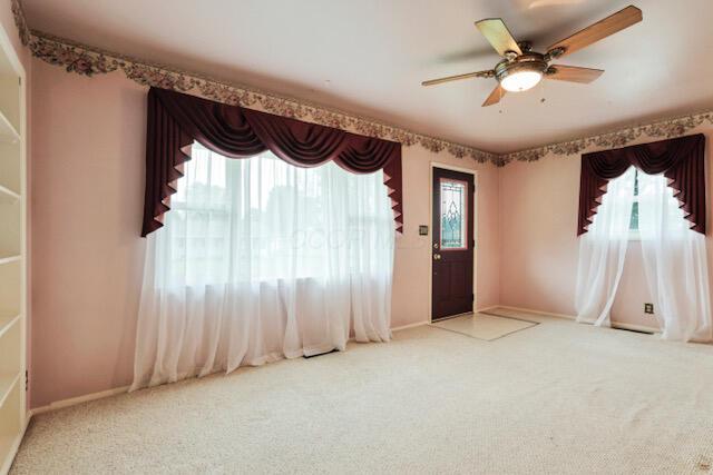 1270 Wetsell Ave, Lancaster, OH 43130 - spare room with carpet, ceiling fan, and baseboards